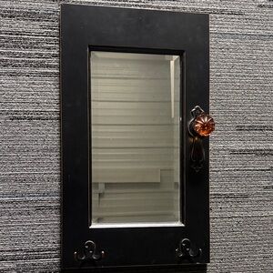 Elegant Black Mirror with Amber Detail
